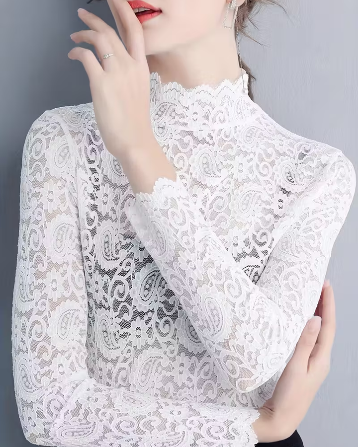 Close-up of women's sophisticated semi-transparent lace long sleeve top with stand collar.