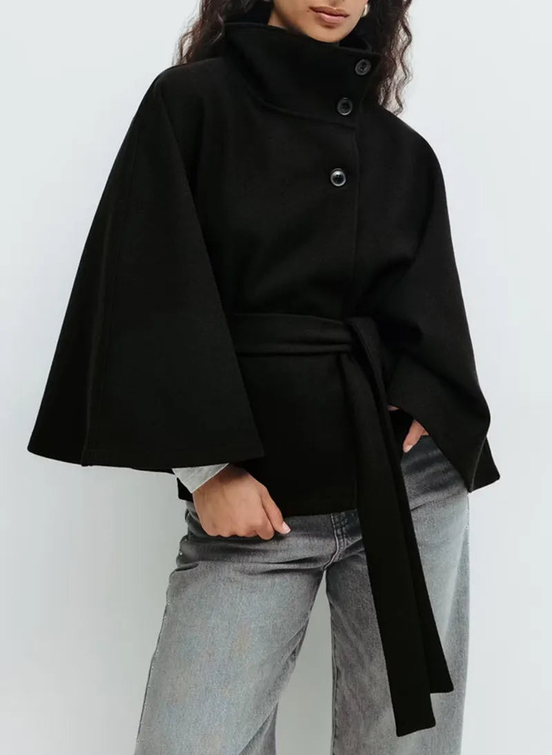 Sophisticated women's spring cape coat with a high neck and belt, suitable for chic outerwear