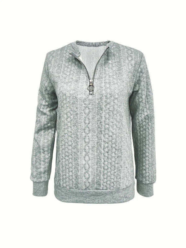 Casual yet sophisticated women's half-zip top with long sleeves, a must-have for spring apparel.