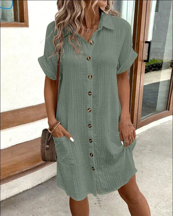Versatile women's elegant spring shirt dress, a relaxed midi fit for comfort and style, button details.