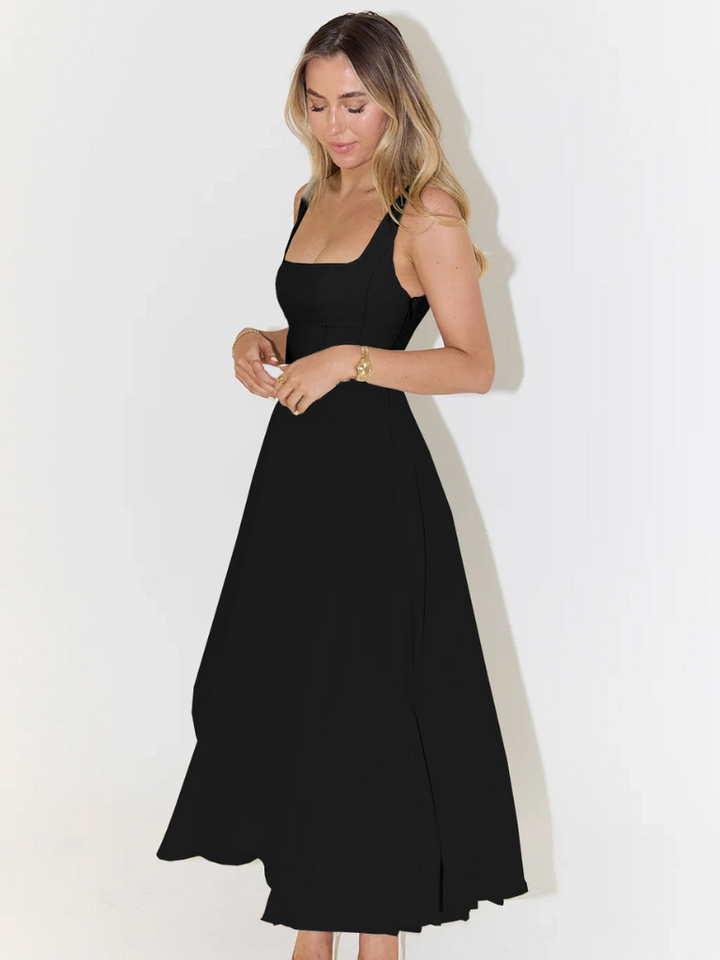 Back view of women's elegant midi dress, showcasing its comfortable fit and graceful silhouette.