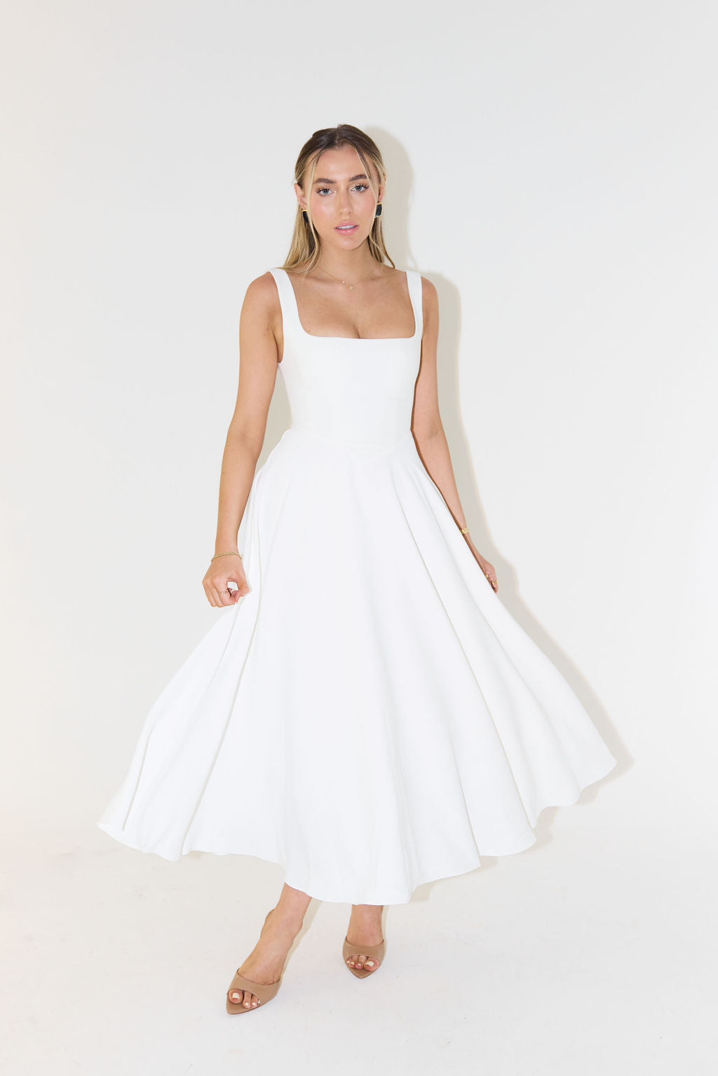 Elegant women's square neck sleeveless midi dress. Perfect for summer casual outings or chic evening wear.
