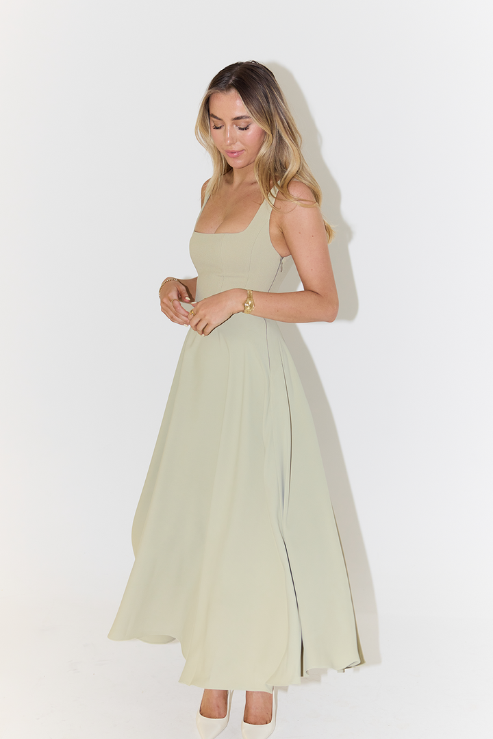 Elegant women's square neck sleeveless midi dress. Perfect day dress or evening wear for summer fashion events.