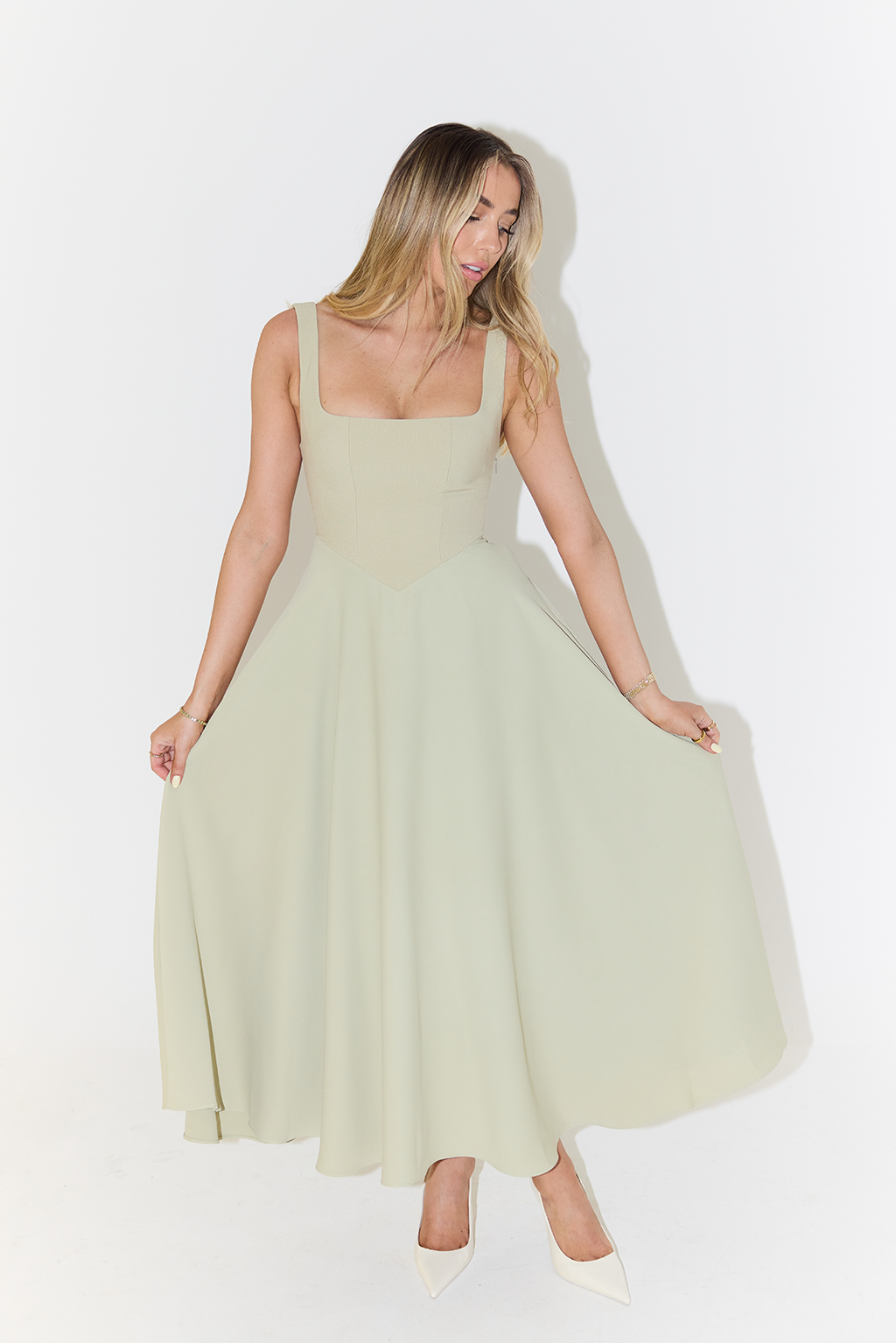 Versatile elegant square neck sleeveless midi dress for women. Ideal for summer casual or sophisticated events.