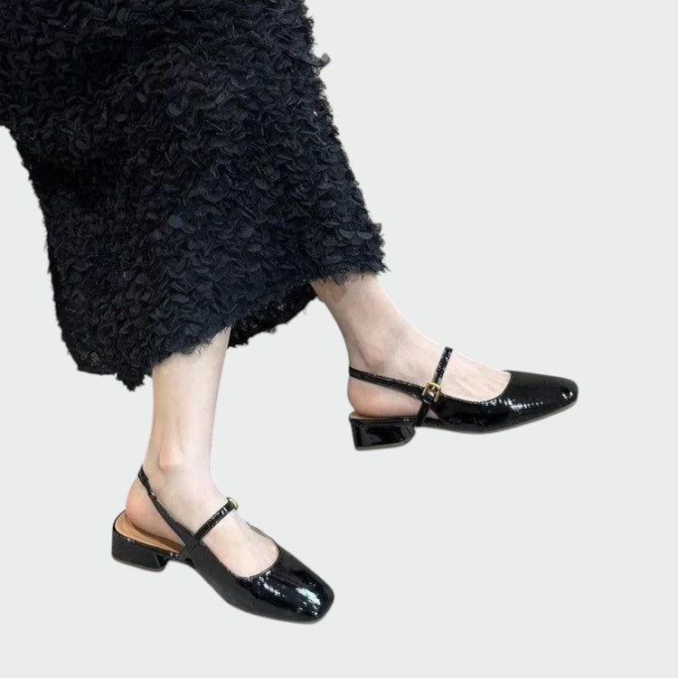 Stylish black square toe Mary Jane shoes with a stable block heel, ideal for sophisticated women's footwear.