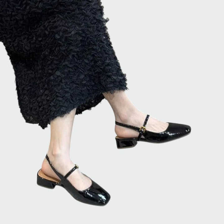Stylish black square toe Mary Jane shoes with a stable block heel, ideal for sophisticated women's footwear.