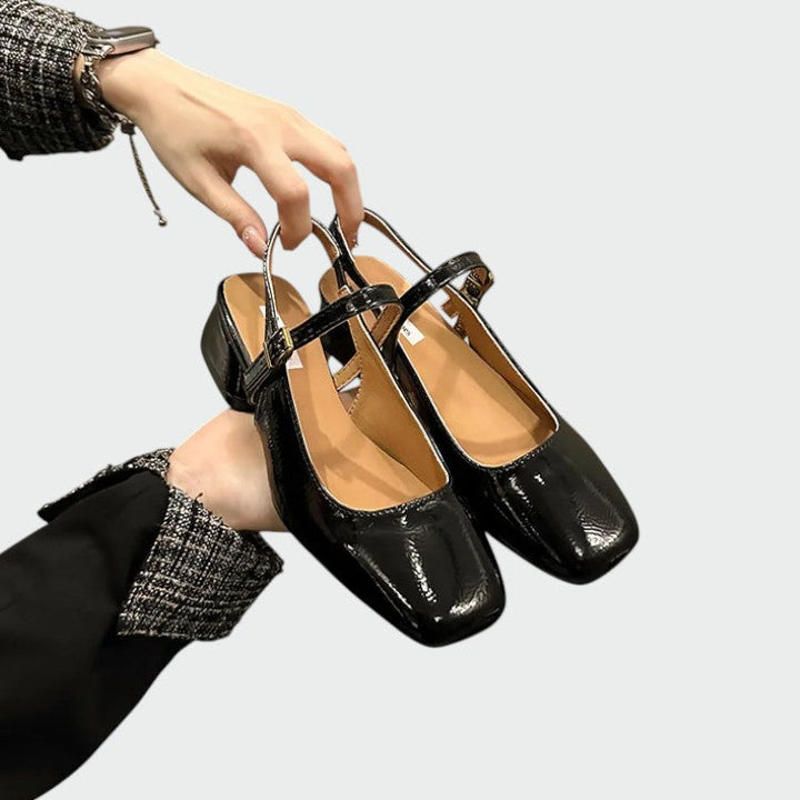 Comfortable women's dress shoes featuring a square toe, block heel, and iconic Mary Jane strap design.