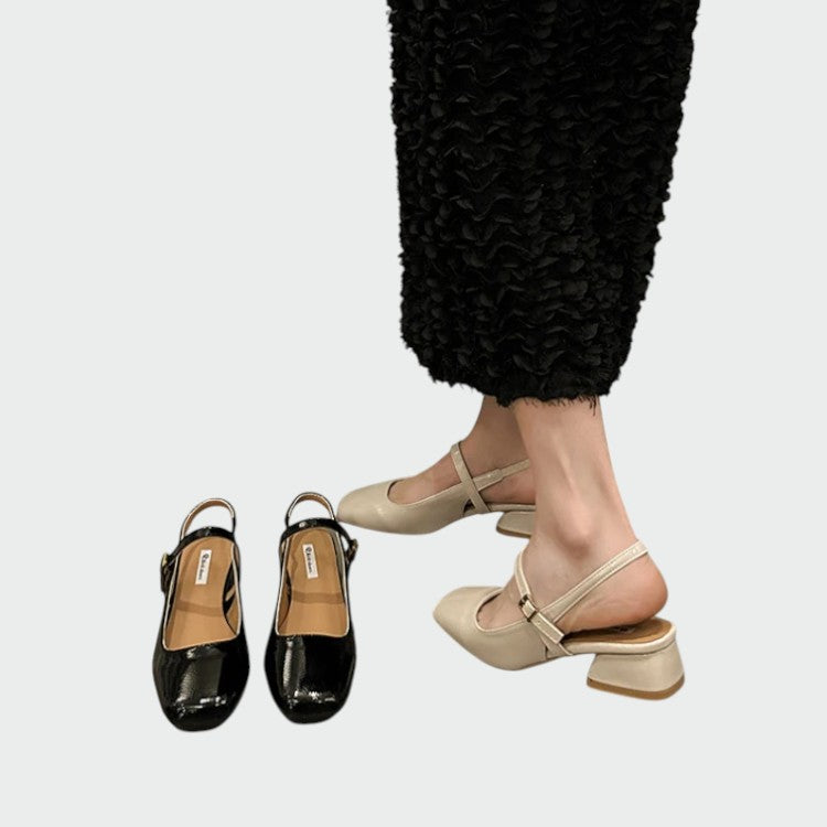 Close-up of women's sophisticated square toe Mary Jane block heel, showcasing elegant footwear details.