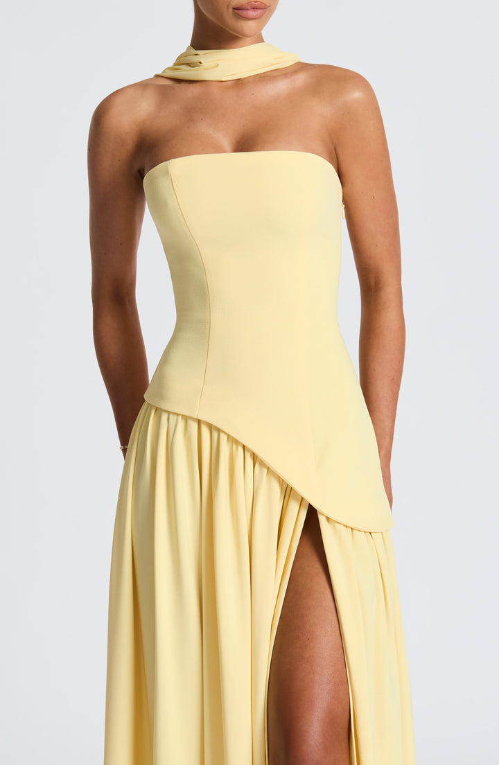 Modern women's strapless formal dress, elegant maxi design with an alluring high slit.