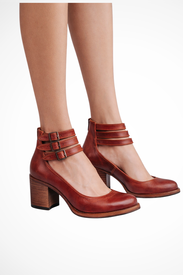 Elegant black strappy block heel sandals, offering comfort and style.