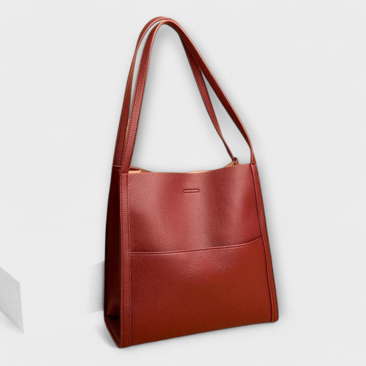Elegant women's structured style handbag in a vibrant spring color, perfect for everyday use or as a fashion accessory.