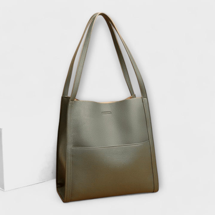 Contemporary women's structured bag, versatile as a shoulder bag, ideal for spring and summer fashion.
