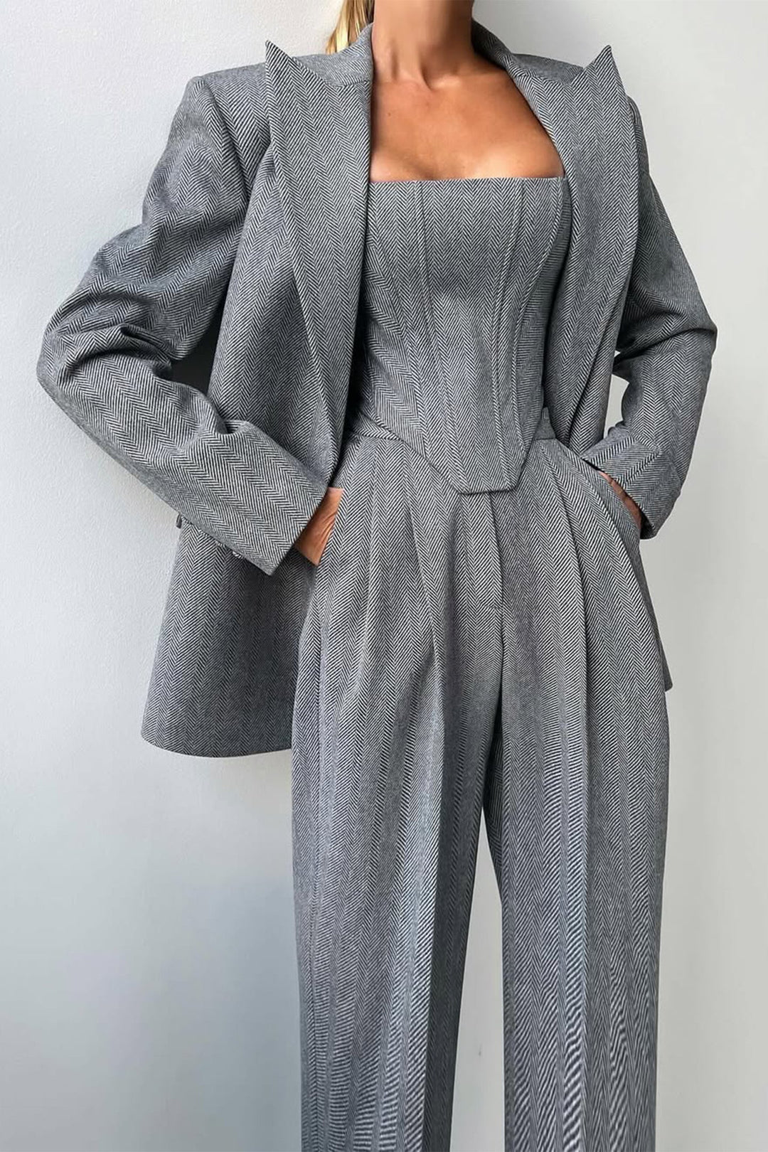 Elegant women's summer three-piece trouser suit in light fabric, perfect for business casual.