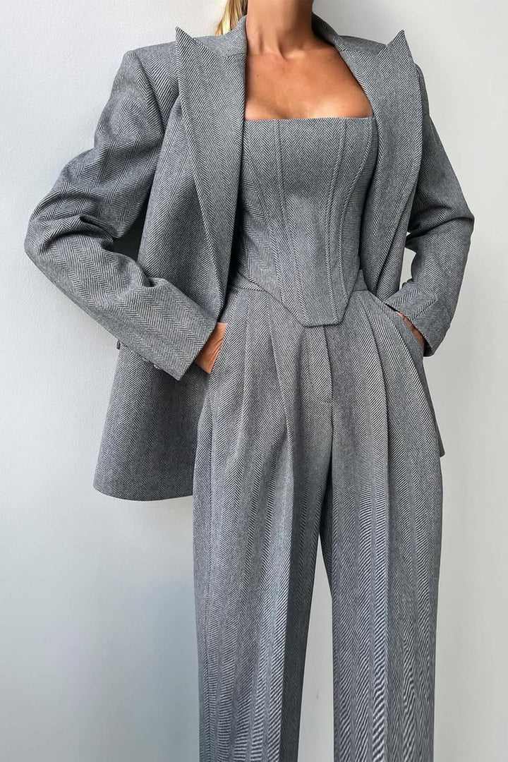 Elegant women's summer three-piece trouser suit in light fabric, perfect for business casual.