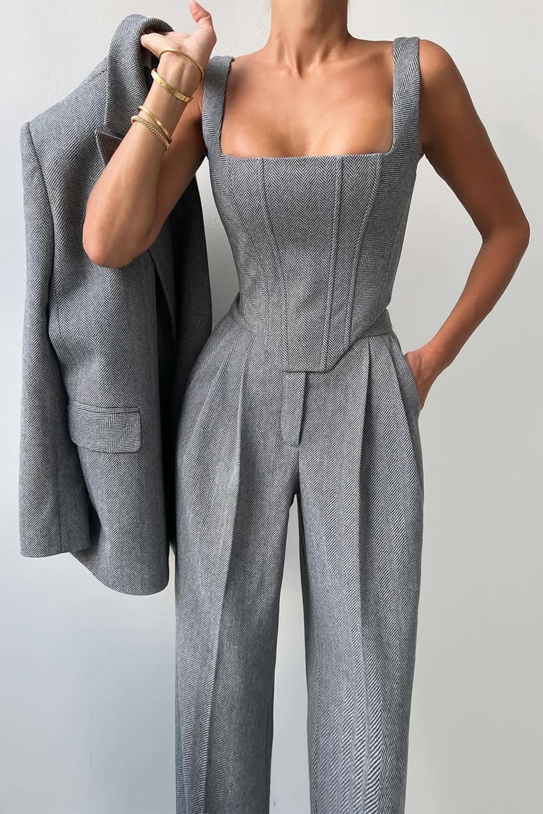 Stylish ladies' tailored three-piece trouser suit for summer, ideal for formal wear.