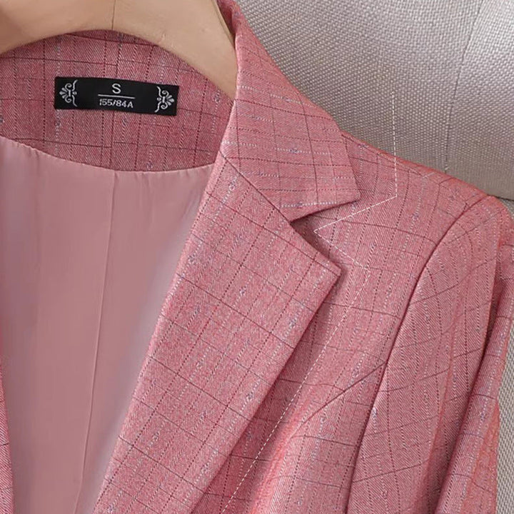 Fashionable women's pink grid pattern blazer, a stylish and elegant tailored jacket for spring.