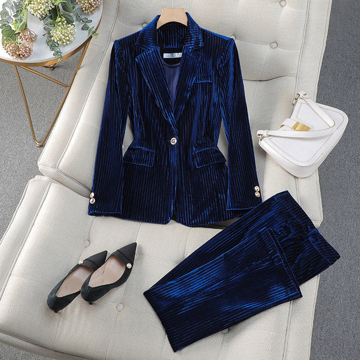 Stylish two-piece women's suit featuring a long, structured blazer and tailored pants, ideal for formal occasions.