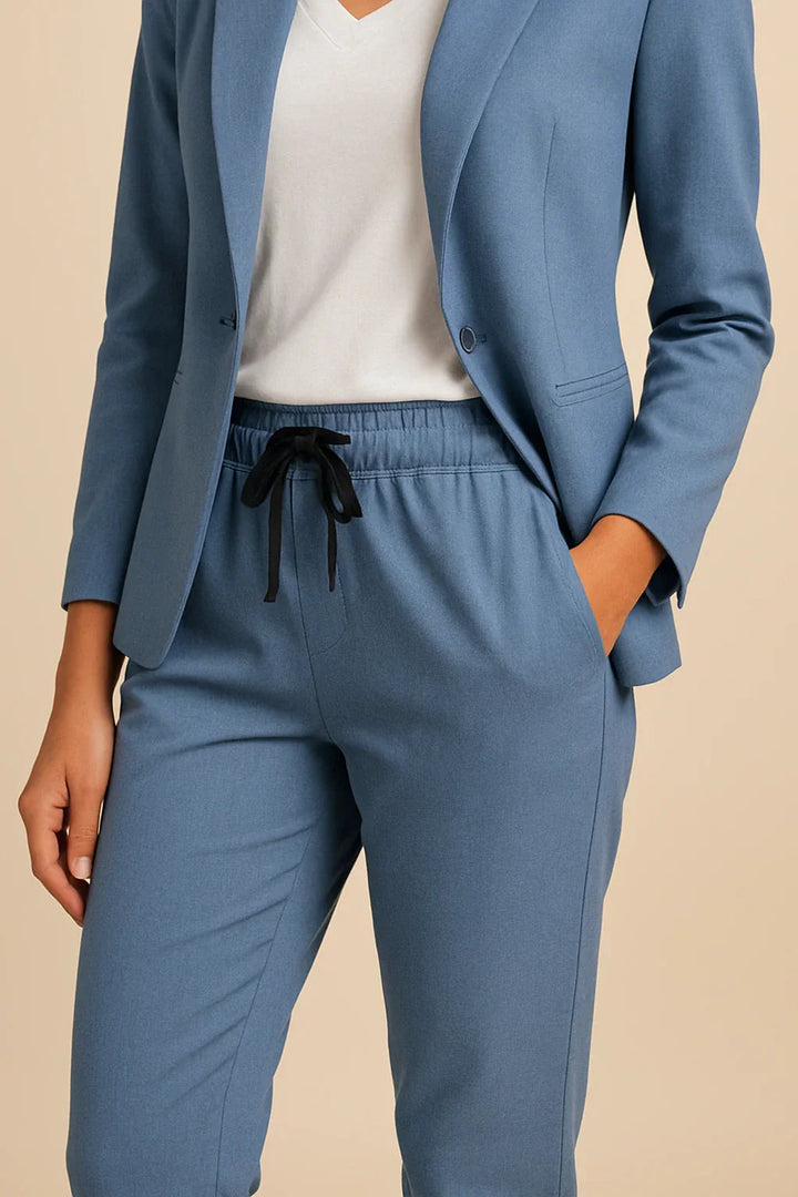 Empowering women's charcoal two-piece suit, a tailored business wear essential for professionals.