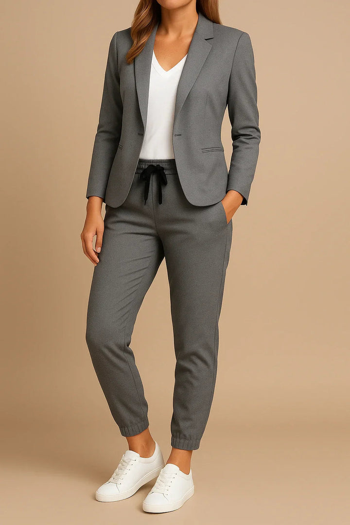 Dapper women's navy double-breasted suit, tailored two-piece set for ultimate elegance.