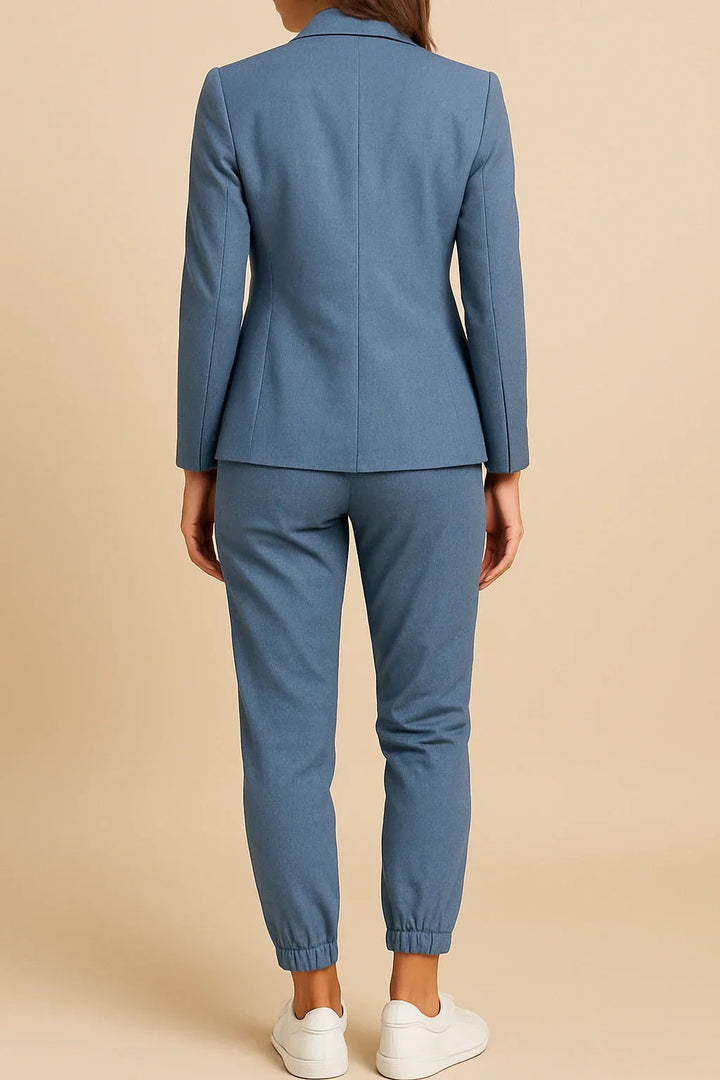 Refined women's tailored grey blazer and matching pants, a versatile two-piece business suit.