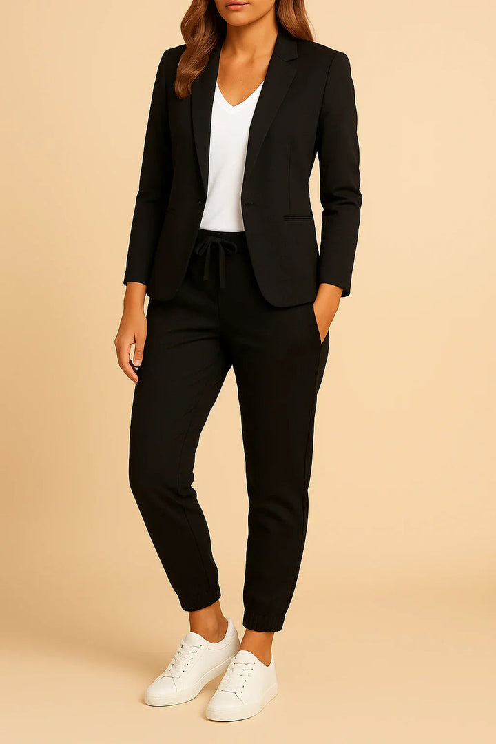 Modern women's tailored light blue suit, perfect two-piece blazer and pants for spring fashion.