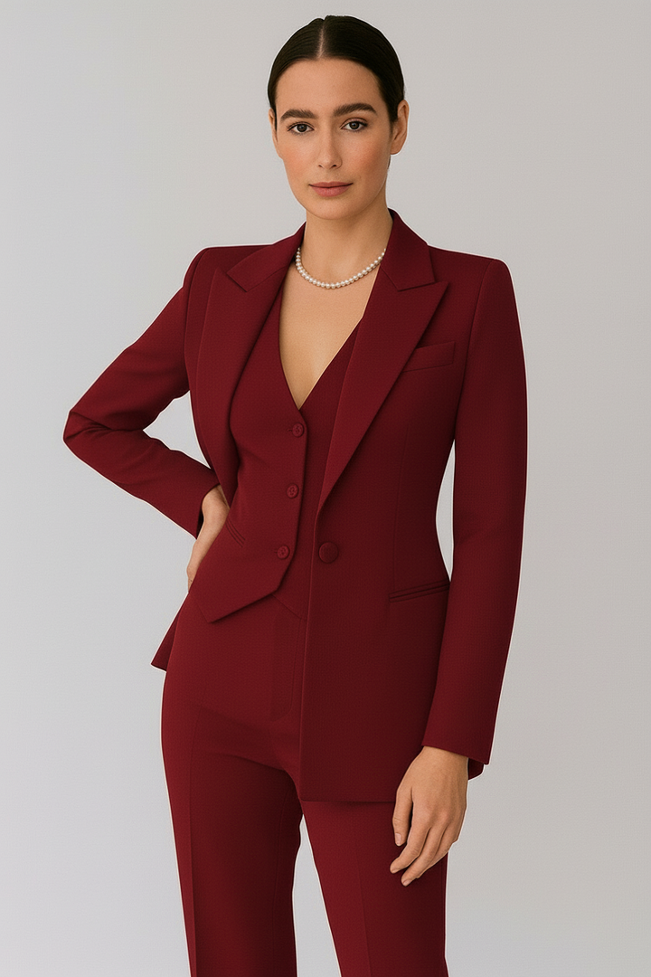Stylish women's three-piece suit featuring a well-fitted blazer, vest, and pants for an elegant look