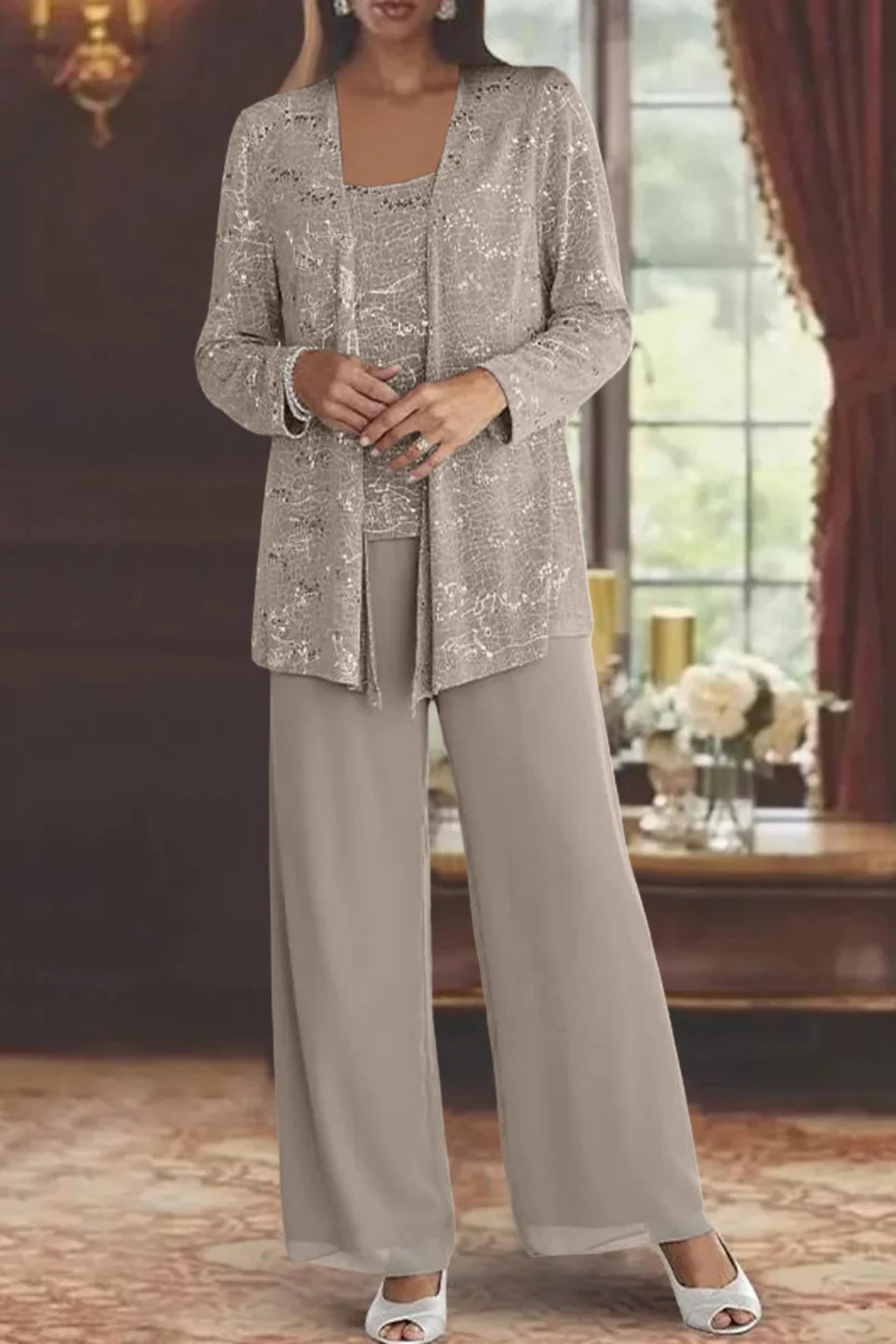 Full-length view of a woman wearing a three-piece sequin & lace wide-leg trouser suit for formal events.