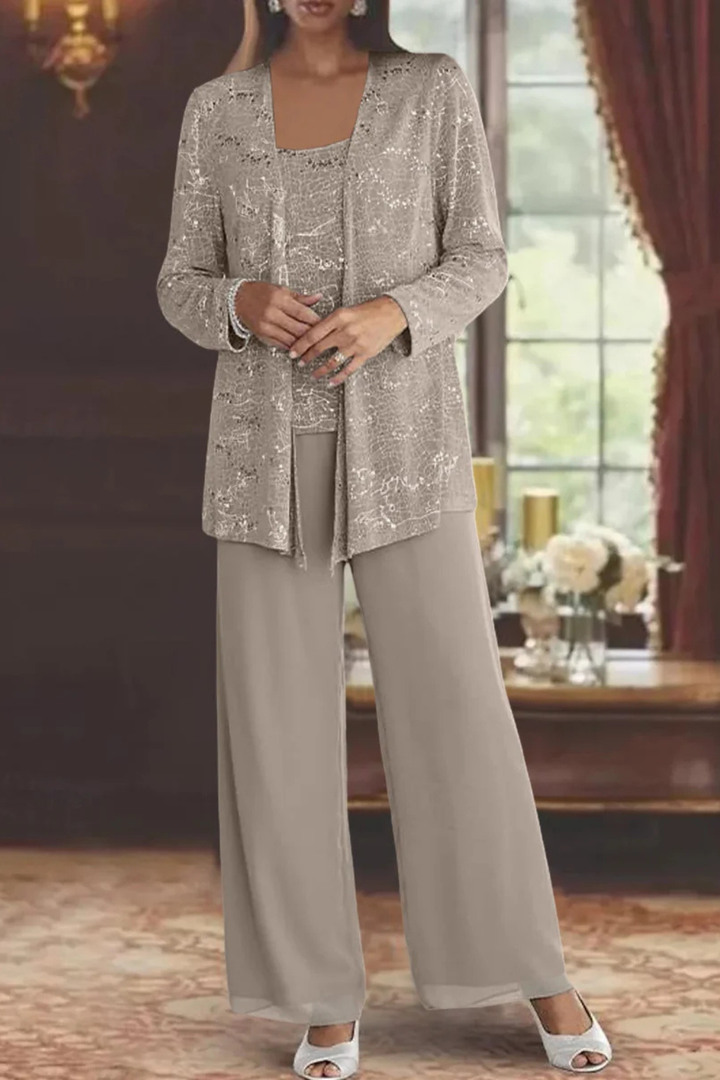 Full-length view of a woman wearing a three-piece sequin & lace wide-leg trouser suit for formal events.