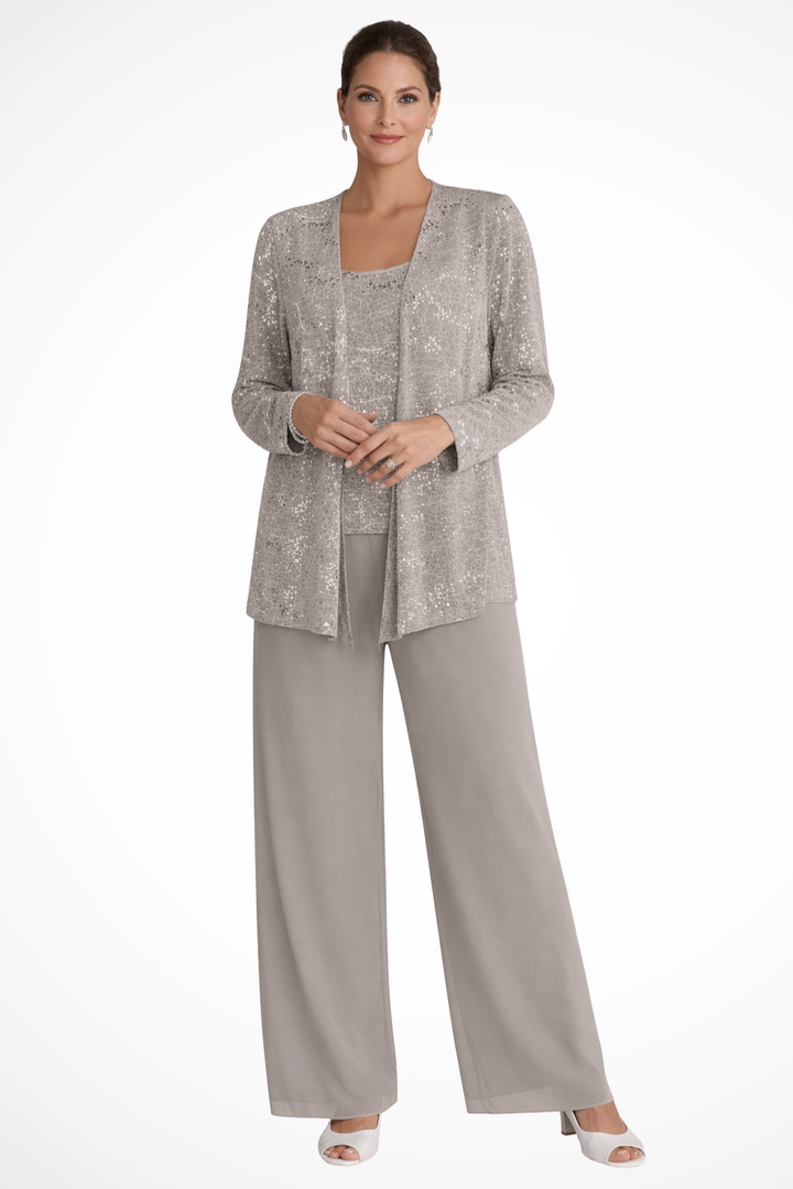 Close-up of shimmering sequin detail on jacket & delicate lace texture on wide-leg trousers of suit.