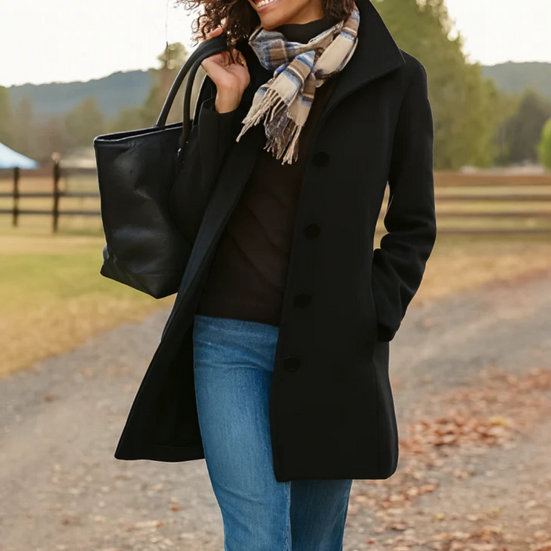 Sophisticated women's long coat, button-up front, embodying timeless and classic style autumn wear