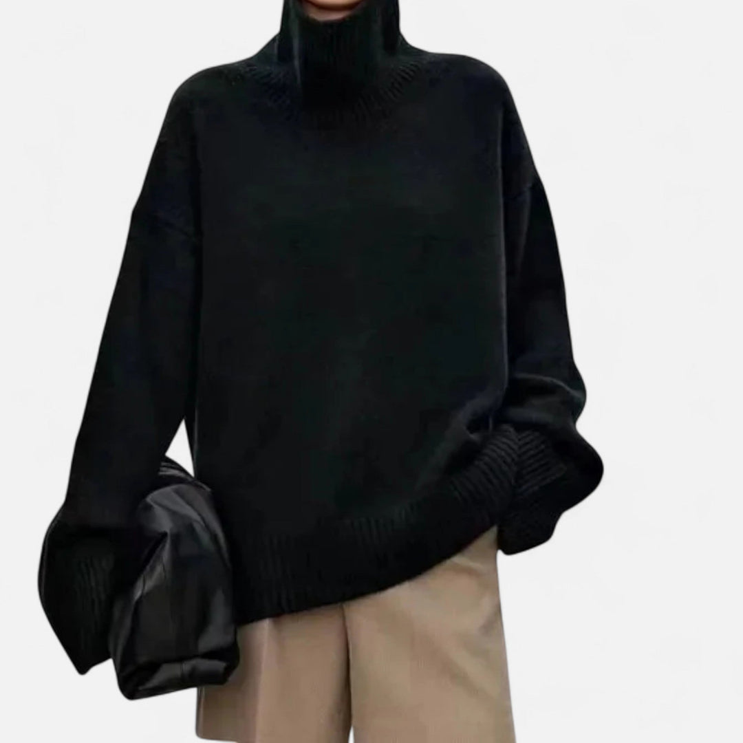 Grey women's turtleneck sweater. Cozy, elegant long sleeve knit top perfect for classic winter fashion.