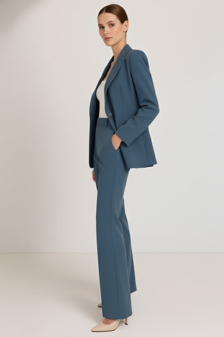 Formal women's two-piece suit set featuring a tailored blazer and straight leg trousers for business fashion.