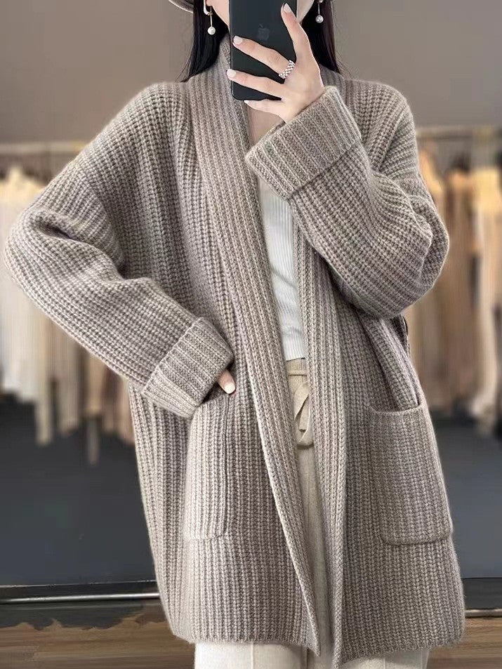 Stylish camel V-neck cardigan for women. Loose fit, cozy knitwear, perfect for elegant fall/winter outfits.