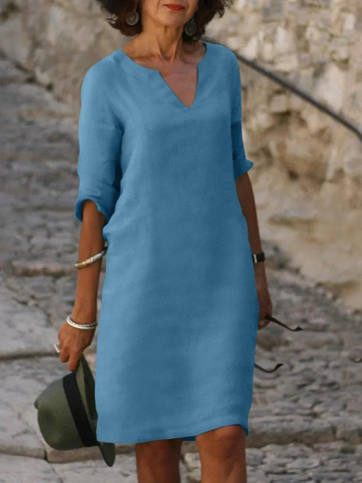 Graceful women's V-neck evening dress. A flattering and versatile choice for formal events and wedding guests.