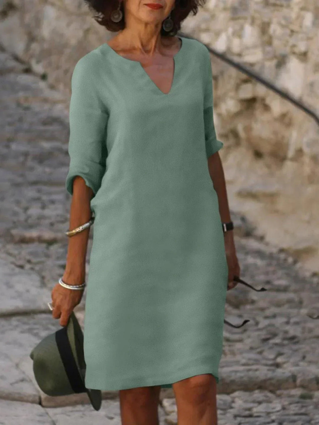 Chic women's V-neck wedding guest dress. Elegant and versatile for any formal event or summer party.