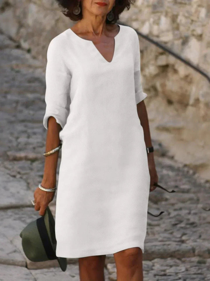 Sophisticated women's V-neck dress with a flattering fit, perfect for formal occasions, weddings, or summer parties.