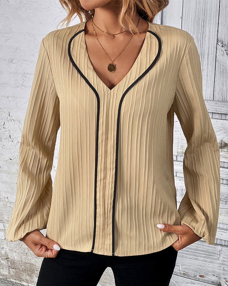 Elegant women's V-neck long sleeve top with chic balloon sleeves, perfect for office or casual wear.