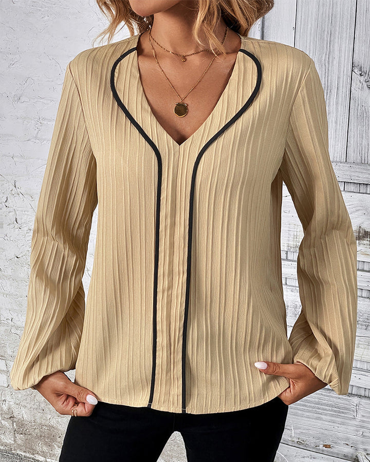 Elegant women's V-neck long sleeve top with chic balloon sleeves, perfect for office or casual wear.