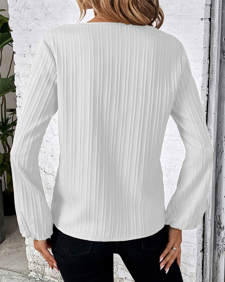 Stylish women's elegant V-neck blouse, long balloon sleeves, perfect for office wear or a chic casual look.