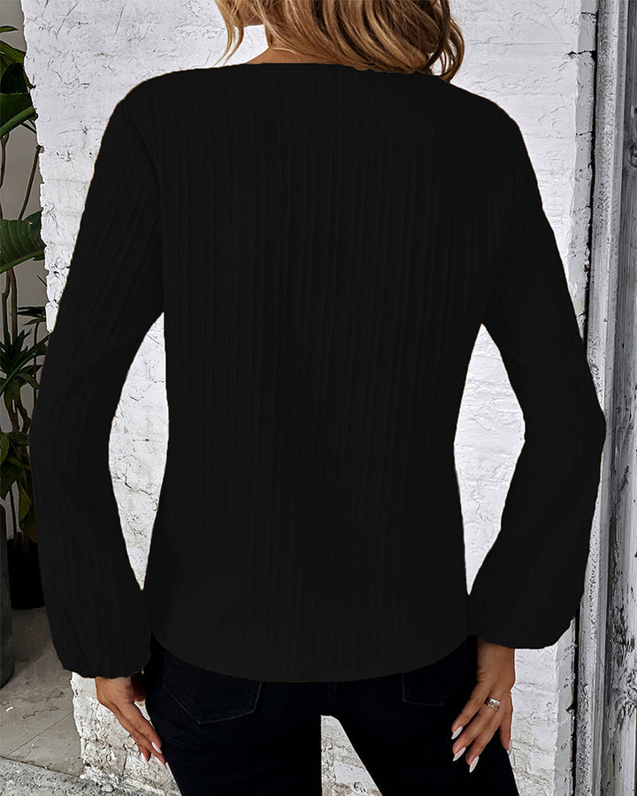 Women's solid V-neck long sleeve top featuring elegant balloon sleeves, a versatile and chic wardrobe staple.
