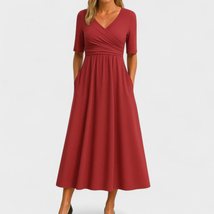 Sophisticated V-neck midi dress for women, offering a comfortable fit with pockets and a flared skirt