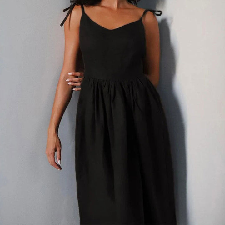 Vacation-ready women's midi dress with V-neck, open back, and leg slit for elegant comfort