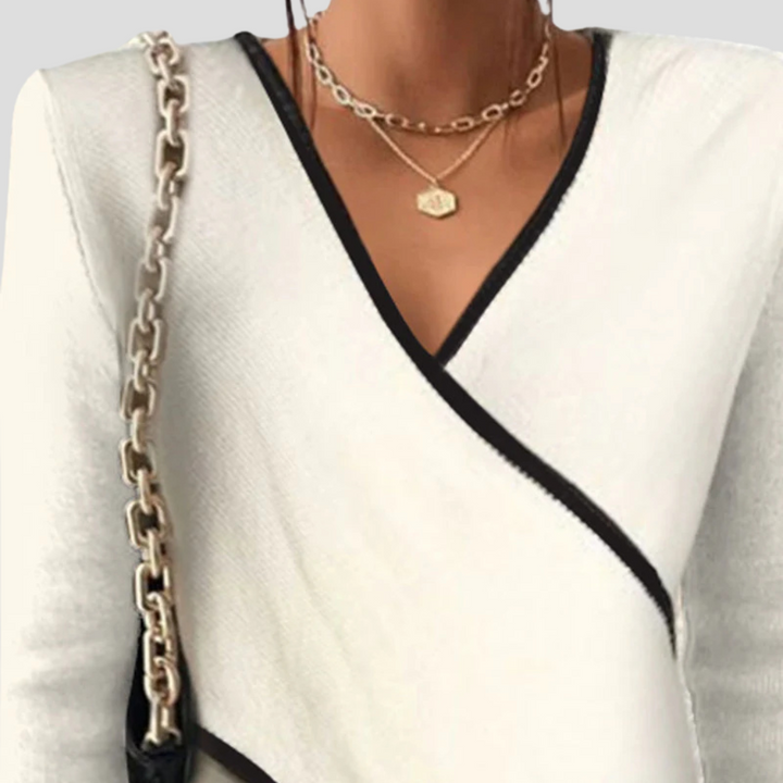 Cozy women's long-sleeve V-neck sweater for comfortable casual wear, ideal for autumn & winter style.