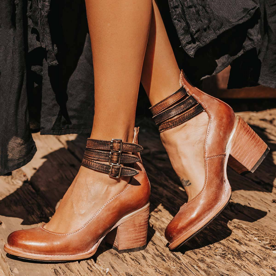 Stylish women's vintage heels featuring an ankle strap and robust block heel, perfect for formal events.