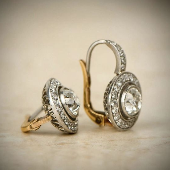 Elegant women's vintage silver earrings featuring sparkling cubic zirconia stones. Perfect fashion jewelry.