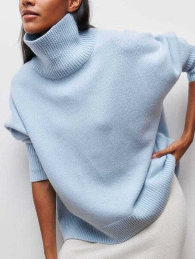 Elegant women's warm turtleneck sweater in soft knit. Perfect for chic winter fashion & cozy comfort.