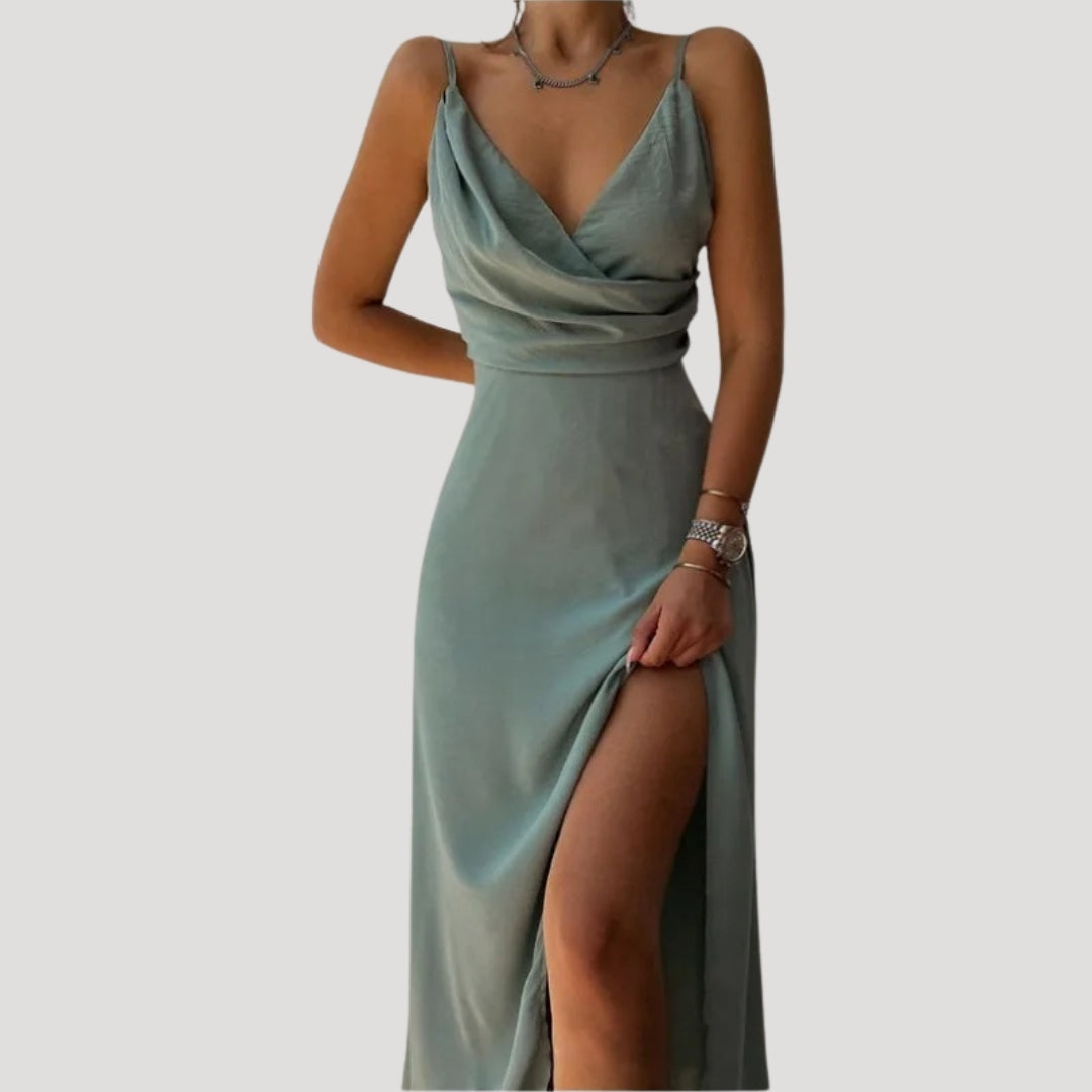 Chic women's evening gown with a graceful slit, appropriate for any formal or wedding guest event.