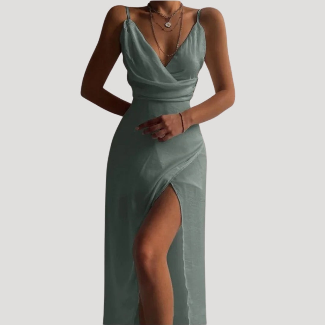 Fashionable women's wedding guest attire: a long, elegant dress with a front slit.
