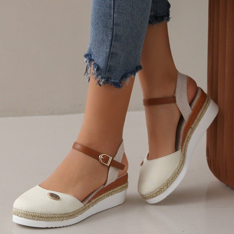 Stylish women's wedge heel sandals featuring intricate woven straps, perfect for elegant summer fashion.