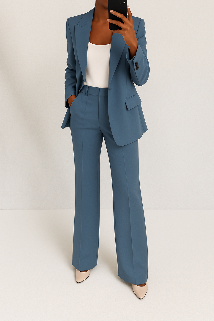 Stylish women's blazer and trouser suit in sophisticated grey, ideal for business attire.